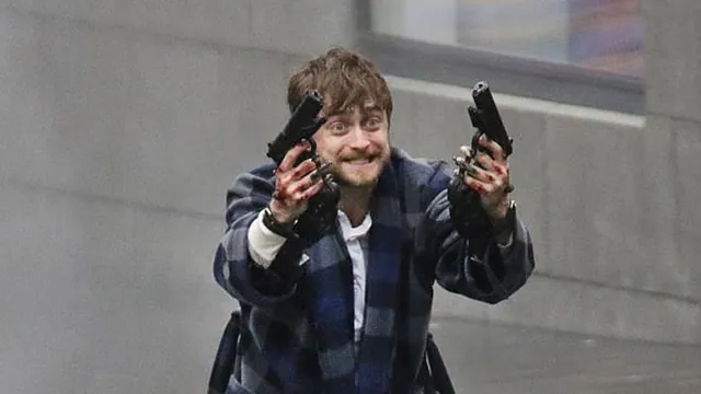 Daniel Radcliffe Holding Two Guns meme card
