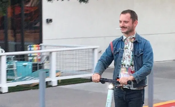 Elijah Wood On a Scooter meme card