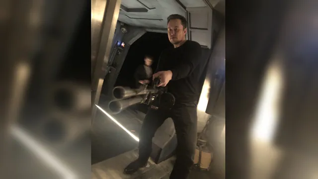Elon Musk Holding a Minigun meme card