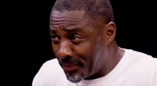 Idris Elba Choking on Hot Wings meme card