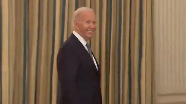 Joe Biden's Evil Smirk meme card