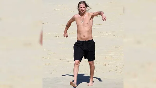 Kid Rock Walking on the Beach meme card