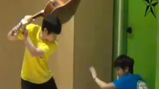 Woozi Hitting Mingyu with A Guitar meme card, common rarity